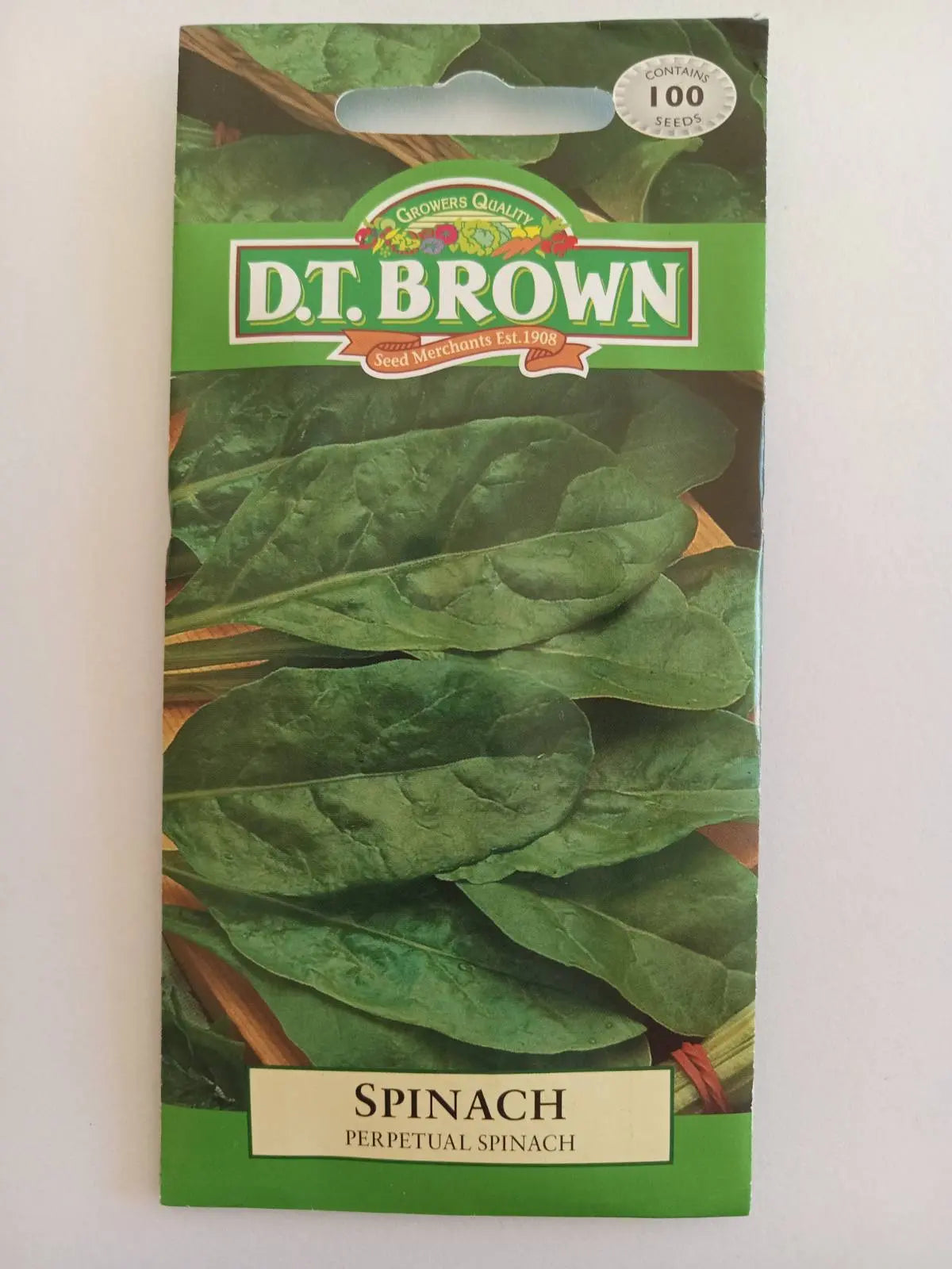 Seed packet for D.T. Brown Spinach on a white background